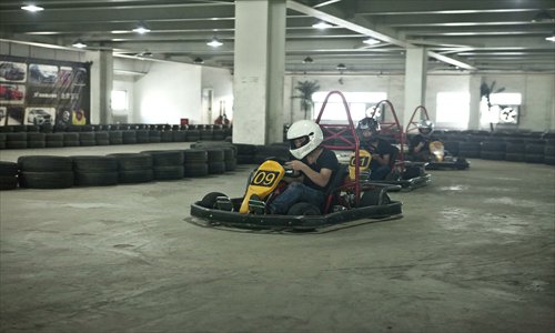 Go-kart racers maneuver the circuit at the U-Speed racetrack in Chaoyang district. Photo: Gou Yingguang/GT