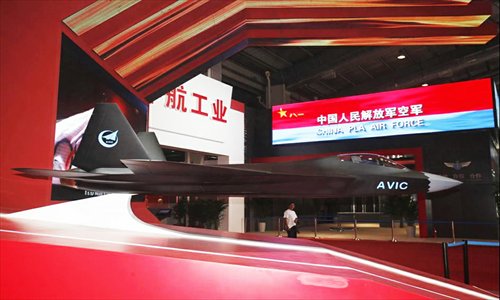 A stealth fighter J-31 model is displayed at the Aviation Industry Corporation of China (AVIC) exhibition hall at the Airshow China 2012 in Zhuhai, Guangdong Province on Monday. The show, now in its ninth year, runs until November 18. Photo: huanqiu.com