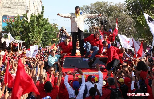 Venezuelan acting president and presidential candidate Nicolas Maduro (C) stands on a vehicle during a campaign rally at Falcon State, Venezuela, on April 10, 2013. Venezuela will hold presidential elections on April 14. (Xinhua/AVN)
