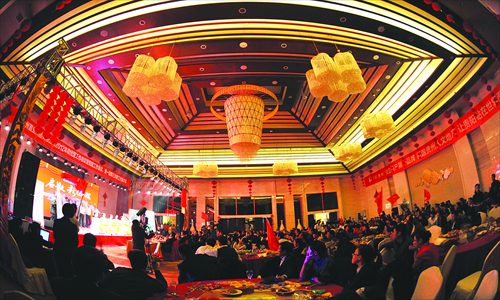The Guizhou branch of Poly Real Estate Co holds its year-end party at a local hotel in Guiyang, Southwest China's Guizhou Province, on January 18. Photo: CFP