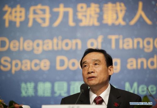 Niu Hongguang, deputy commander-in-chief of China's manned space program, attends a press conference in South China's Hong Kong, August 10, 2012. A 40-plus-member delegation of Tiangong-1/Shenzhou-9 Manned Space Docking and Rendezvous Mission, including three astronauts who had fulfilled China's first manned space docking mission this June, arrived at Hong Kong Friday for a four-day visit. Photo: Xinhua