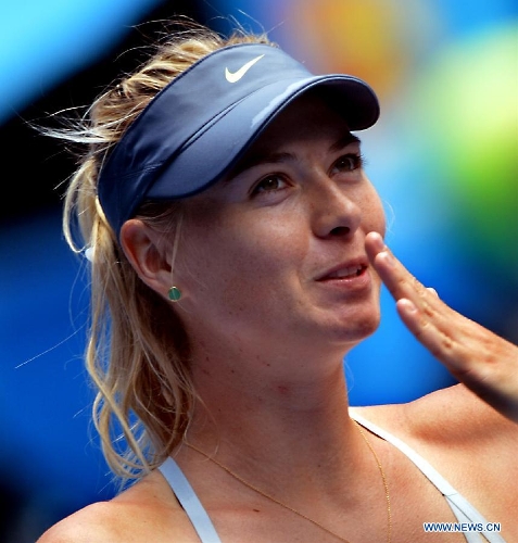 &nbsp;Maria Sharapova of Russia reacts after winning her first round women's singles match against her compatriot Olga Puchkova on the first day of 2013 Australian Open tennis tournament in Melbourne, Australia, Jan. 14, 2013. Maria Sharapova won 2-0 to enter the next round. (Xinhua/Chen Xiaowei) 