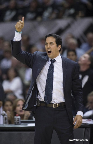 Miami Heat's head coach Erik Spoelstra reacts during Game 3 of the 2013 NBA Finals against San Antonio Spurs in San Antonio, Texas, the United States, June 11, 2013. Miami Heat lost 77-113. (Xinhua/Yang Lei)