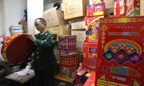 Shanghai fire offcials discover a large stash of uncertified fireworks Wednesday in an apartment in Xuhui district. Police said it was unusual to find stashes of illicit fireworks downtown. Photo: Yang Hui/GT