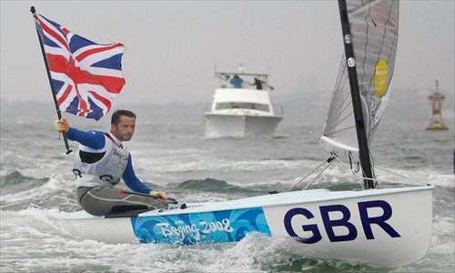 Ben Ainslie celebrating after winning the gold medal during the Finn sailing competition at the 2008 Beijing Olympic Games in Qingdao, China. Photo: IC