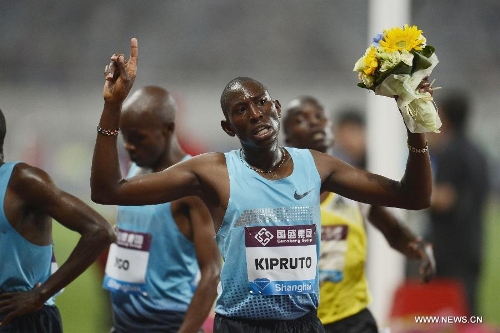 Kenya's Conseslus Kipruto celebrates after winning the men's 3000 meters steeplechase during the IAAF Diamond League Athletics meet in Shanghai, east China, May 18, 2013. Conseslus Kipruto won the first place of the event in 8 minutes and 1.16 seconds.(Xinhua/Li Jundong) 