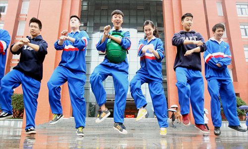 Students in Yali High School in Changsha, Hunan Province show off their Gangnam Style dance moves on Monday. Photo: CFP