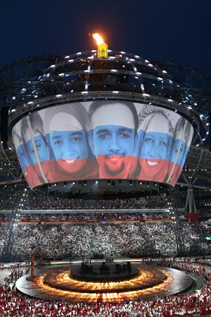 On Wednesday, a video screen shows the faces of young people and the national colors of Russia during the closing ceremony of the 27th Summer Universiade, which was held from July 6 to Wednesday in Kazan, Russia. Gwangju of South Korea will hold the next Summer Universiade in 2015. Photo: AFP