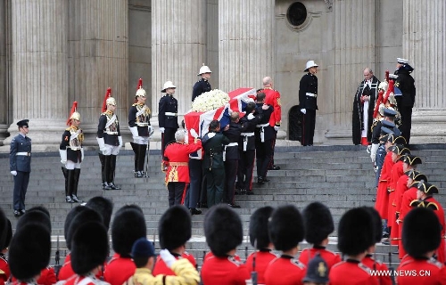 The coffin of British former prime minister Margaret Thatcher is carried into St Paul's Cathedral in London, Britain, April 17, 2013. The funeral of Margaret Thatcher, the first female British prime minister, started 11 a.m. local time on Wednesday in London. (Xinhua/Yin Gang) 