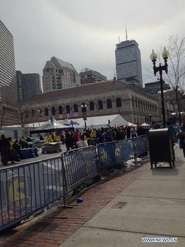 Photo taken on April 15, 2013 shows the street following explosions happened in Boston, the United States. Three explosions occurred near the Boston Marathon finish line, killing at least 2 people, local media reported. (Xinhua/Zhao Xirong) 