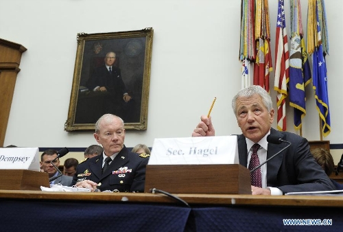 U.S. Secretary of Defense Chuck Hagel (R) and Chairman of Joint Chiefs of Staff General Martin Dempsey testify before the House Armed Services Committee during a hearing on the fiscal year 2014 national defense authorization budget request from the Department of Defense, on Capitol Hill in Washington D.C., capital of the United States, April 11, 2013. U.S. President Barack Obama on Wednesday proposed a 526.6-billion-dollar base budget for the Defense Department in fiscal year 2014, as the Pentagon struggles to provide funds for its strategic rebalance to the Asia Pacific amid mandatory budget cuts. (Xinhua/Zhang Jun) 