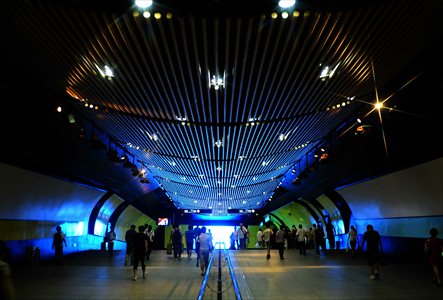 Metro Line 4 runs through the city above the ground. (Bottom inest) Passengers at Xujiahui station. 