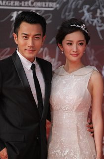 Yang Mi (right) and Liu Kaiwei pose for the photos during the 15th Shanghai International Film Festival in Shanghai, east China, June 16, 2012.