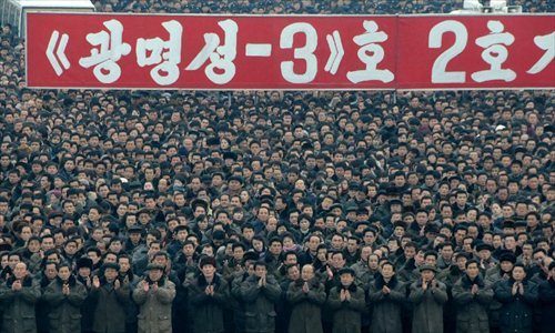 People attend a celebration for the successful launch of the Kwangmyongsong-3 satellite in Pyongyang, capital of the Democratic People's Republic of Korea (DPRK), on Dec. 14, 2012. According to the DPRK's official media KCNA, a Unha-3 rocket carrying the second version of the Kwangmyongsong-3 satellite blasted off from the Sohae Space Center in Cholsan County, North Phyongan Province, on Dec. 12.  Photo: Xinhua