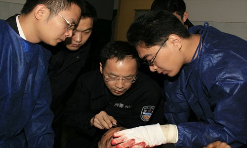 Forensic pathologists of Police 803 from the Shanghai Public Security Bureau conduct an autopsy.