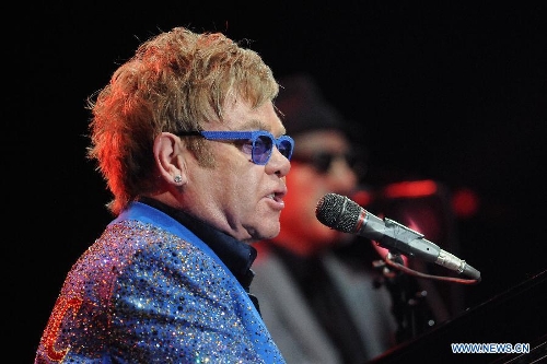 British singer Elton John performs during his concert at the Gran Parque Central in Montevideo, capital of Uruguay, March 4, 2013. (Xinhua/Nicolas Celaya) 