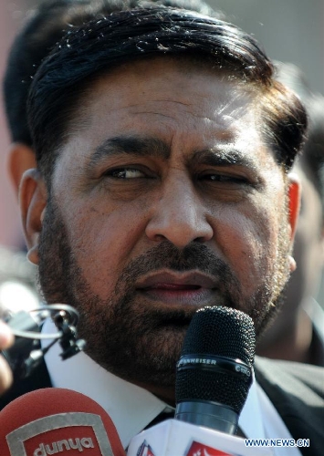 Chaudhry Zulfikar (C), a prosecutor, receives interview outside an anti-terrorism court in Rawalpindi, Pakistan on April 30, 2013. Pakistani investigators said Tuesday that they have 