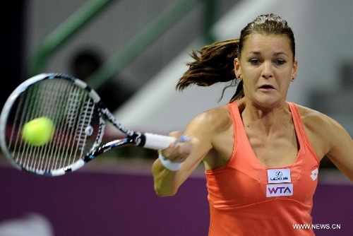 Agnieszka Radwanska of Poland returns a shot during the women's semifinal against Victoria Azarenka of Belarus at the Qatar Open tennis tournament in Doha, capital of Qatar, Feb. 16, 2013. Radwanska lost 0-2. (Xinhua/Chen Shaojin) 