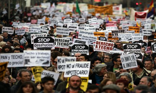 Demonstrators holding banners reading 