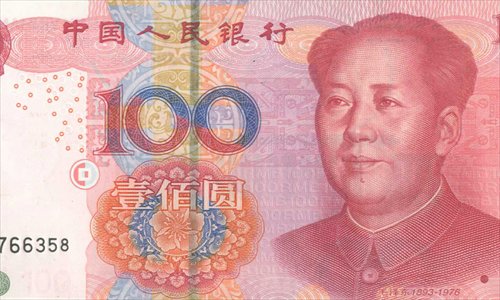 A detail on a 100-yuan note, when slightly stylized, looks like three cats.  Photo: Web