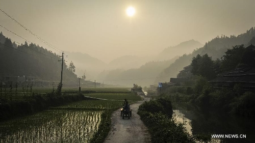 Photo taken on June 21, 2013 shows the Dimen Dong minority village in the morning in Liping County of southwest China's Guizhou Province. Dimen is a Dong minority village with about 2,500 villagers. It is protected properly and all the villagers could enjoy their peaceful and quiet rural life as they did in the past over 700 years. (Xinhua/Ou Dongqu)