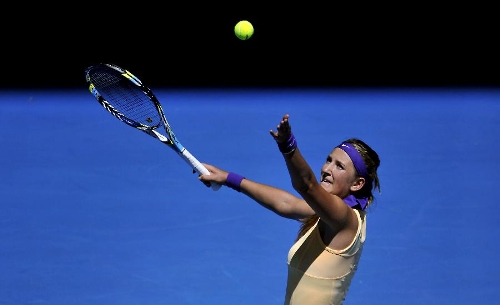 Victoria Azarenka of Belarus serves the ball during her first round women's singles match against Monica Niculescu of Romania on the second day of 2013 Australian Open tennis tournament in Melbourne, Australia, Jan. 15, 2013. Victoria Azarenka won 2-0 to enter the next round. (Xinhua/Chen Xiaowei) 
