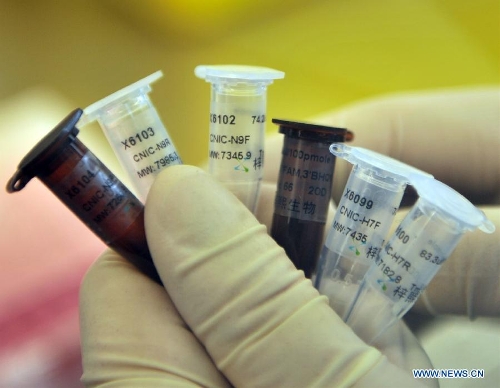 A technician holds test reagents for H7N9 bird flu virus at the Beijing Center for Diseases Control and Prevention in Beijing, China, April 3, 2013. Test reagents for H7N9 virus have arrived in Beijing on April 2. And the city's diseases control and prevention centre along with 55 laboratories in its network are capable of testing the virus. (Xinhua/Li Wen) 