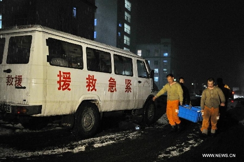 Rescuers carry relief materials at the Babao Coal Mine in Jiangyuan District in the city of Baishan, northeast China's Jilin Province, April 1, 2013. Another coal-mine gas explosion left six people dead and 11 missing in the coal mine on Monday, three days after a similar blast killed 28 miners at the same site. (Xinhua/Zhang Nan) 