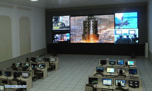 Photo released by the official KCNA news agency of the Democratic People's Republic of Korea (DPRK) on December 12, 2012 shows technicians monitoring the launching of the satellite Kwangmyongsong-3 at the satellite control center. According to the KCNA, the second version of Kwangmyongsong-3 was launched by an Unha-3 carrier rocket at 9:49 a.m. local time (0049 GMT) Wednesday from the Sohae Space Center in Cholsan County, North Phyongan Province, and entered the preset orbit. Photo: Xinhua