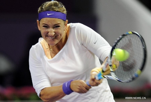Victoria Azarenka of Belarus returns a shot to Agnieszka Radwanska of Poland during their women's semifinal at the Qatar Open tennis tournament in Doha, capital of Qatar, Feb. 16, 2013. Azarenka won 2-0. (Xinhua/Chen Shaojin) 