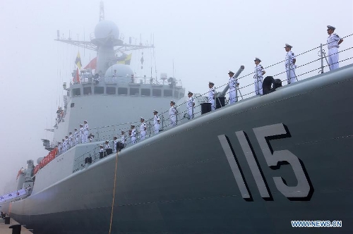 Officers and soldiers of Chinese navy stand on the destroyer Shenyang during a ceremony for the departure of a fleet in the port of Qingdao, east China's Shandong Province, July 1, 2013. A Chinese fleet consisting of seven naval vessels departed from east China's harbor city of Qingdao on Monday to participate in Sino-Russian joint naval drills scheduled for July 5 to 12. The eight-day maneuvers will focus on joint maritime air defense, joint escorts and marine search and rescue operations. (Xinhua/Zha Chunming)