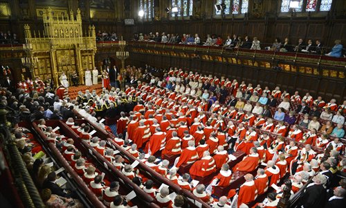 Britain's Queen Elizabeth delivers her speech during the State Opening of Parliament at the House of Lords, alongside Prince Philip, The Duke of Edinburgh in London on Wednesday. British Prime Minister David Cameron pledged a fresh clampdown on immigration via the Queen's Speech, seeking to bolster his right-wing credentials and counter the rise of the UK Independence Party (UKIP). Photo: AFP