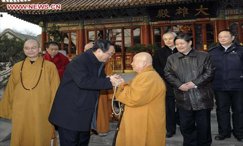 Yu Zhengsheng, a member of the Standing Committee of the Political Bureau of the Communist Party of China (CPC) Central Committee, visits The Buddhist Association of China in Beijing, capital of China, January 21, 2013. Yu visited national religious groups in Beijing from January 21 to 23.(Xinhua/Rao Aimin)