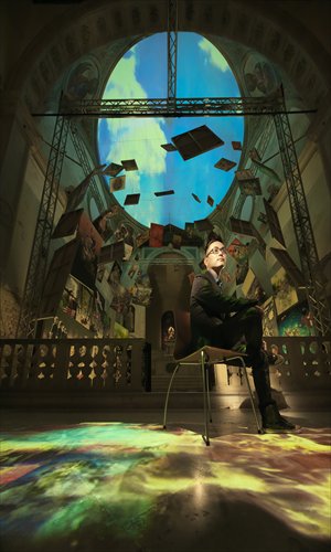 Zhong Biao sits near his works in Santa Maria della Salute Church in Venice in May. Photo: Courtesy of Zhong Biao
