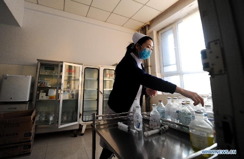 A nurse is seen working in a hospital receiving injured miners in Baishan, northeast China's Jilin Province, March 30, 2013. Twenty-eight people were confirmed dead and 13 others injured in a gas blast at Babao Coal Mine in Jiangyuan District in the city of Baishan around 10:40 p.m. (1440 GMT) late Friday. The injuries of the 13 were not life threatening, said a spokesman with the provincial work safety and supervision bureau. Rescue work has been finished, and the cause of the accident is under investigation. (Xinhua/Xu Chang)