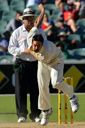 Australian paceman Mitchell Johnson bowls during day two of the second Ashes Test cricket match against England in Adelaide on December 6. Photo: CFP