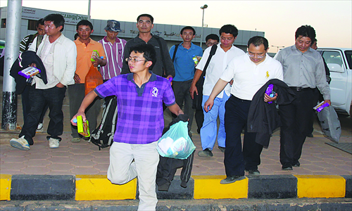 Fourteen Chinese workers taken hostage by Sudanese rebels are released in Khartoum, Sudan, on January 30, 2012. The remaining 15 hostages were later freed by Sudanese troops. 
Photo: CFP