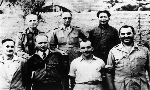 A photograph taken in 1944 showing Mao Zedong (first from right in the second row) with foreign correspondents in Yan'an  Photo: Courtesy of Shanghai Municipal Archives Bureau