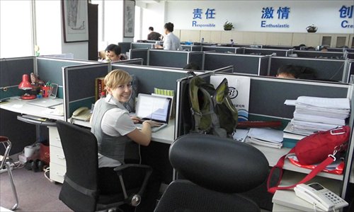Elizabeth Thomas works as an intern at the Beijing-based Globe-Law law firm on June 24. Photo: courtesy of Get in2 China Group Ltd.