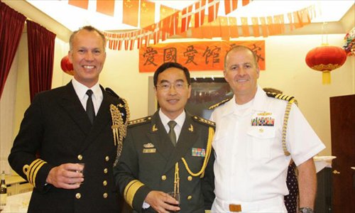 Defense Attache Senior Col. Chen Yong at the Chinese Embassy in Danmark (C), Commander Martin Smith (L), defense attache at the UK Embassy in Denmark, and Captain R. Alistair Borchert, defense and navy attache at the U.S. Embassy in Denmark, pose for a photo during a reception marking the 85th anniversary of the establishment of the Chinese People's Liberation Army, at the Chinese Embassy in Danmark in Copenhagen, Danmark, July 30, 2012. The Chinese embassy in Denmark hosted a reception here Monday to mark the 85th anniversary of the establishment of the Chinese People's Liberation Army. Photo: Xinhua