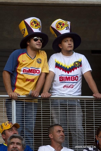 America's fans react before a Liga MX soccer match against Chivas at the Omnilife Stadium in Zapopan, Mexico, on March 31, 2013. (Xinhua/StraffonImages) 