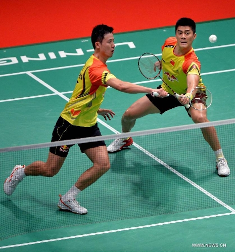 Cai Yun and Fu Haifeng (R) of China compete during the 2013 Sudirman Cup world mixed team badminton championship against Indonesia's Hendra Setiawan and Angga Pratama in Kuala Lumpur, Malaysia, on May 21, 2013. The Chinese pair won 2-1. (Xinhua/Chen Xiaowei) 