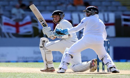 New Zealand's Peter Fulton (left) bats as England wicketkeeper Matt Prior looks on during day four of the international cricket Test match between New Zealand and England in Auckland on Monday. Photo: AFP