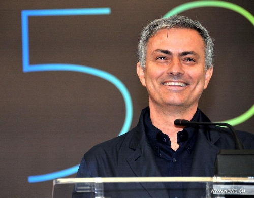 Real Madrid coach Jose Mourinho reacts at a press conference as he attends 