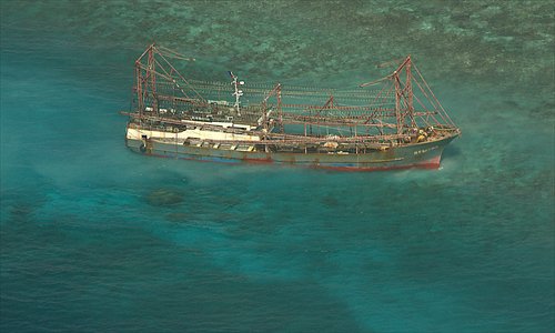 This undated handout aerial photo received on Wednesday and released by Philippine Naval Forces West shows a Chinese fishing boat which ran aground off Tubbataha Reef, in Palawan island, Western Philippines. The fishing vessel has run aground on a World Heritage-listed coral reef in the Philippines, Philippine authorities said on Tuesday. Photo: AFP