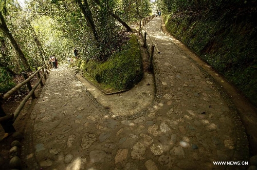 People visit the San Agustin Archaeological Park in Huila, Colombia, on March 31, 2013. San Agustin Archaeological Park is located in the southern Colombian Department of Huila, which will celebrate its centenary and being denominated as World Cultural Heritage in 1995 by United Nations Educational, Scientific and Cultural Organization (UNESCO) this year. (Xinhua/Jhon Paz)