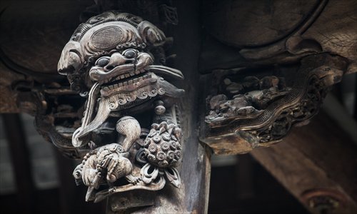 This photo taken on February 13 shows a wood carving above the ancestral hall of the local Hu family in Huangshan, Anhui Province. Photo: CFP