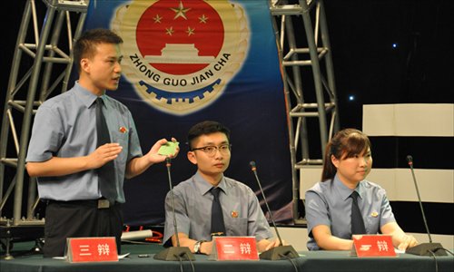 Public prosecutors speak at a televised debate contest between prosecutors and lawyers in Zunyi, Guizhou Province on July 11. Photo: IC