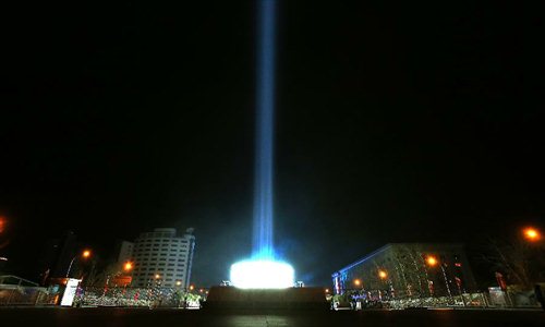 The lights of Beijing are seen at the China Millennium Monument to celebrate the New Year in Beijing, capital of China. January 1, 2013. Photo: Xinhua