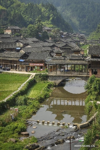 Photo taken on June 21, 2013 shows the Dimen Dong minority village in the morning in Liping County of southwest China's Guizhou Province. Dimen is a Dong minority village with about 2,500 villagers. It is protected properly and all the villagers could enjoy their peaceful and quiet rural life as they did in the past over 700 years. (Xinhua/Ou Dongqu)